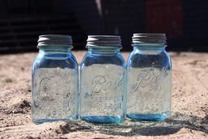 Mason jars are made of glass with lids that have a rubber rings for the purpose of creating an airtight seal, inhibiting the oxidation process